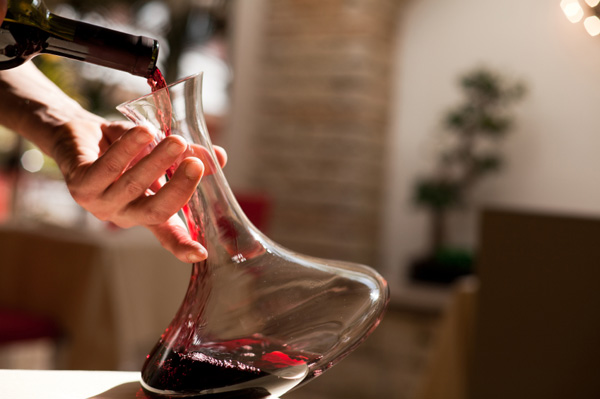 waiter-pouring-wine-into-decanter