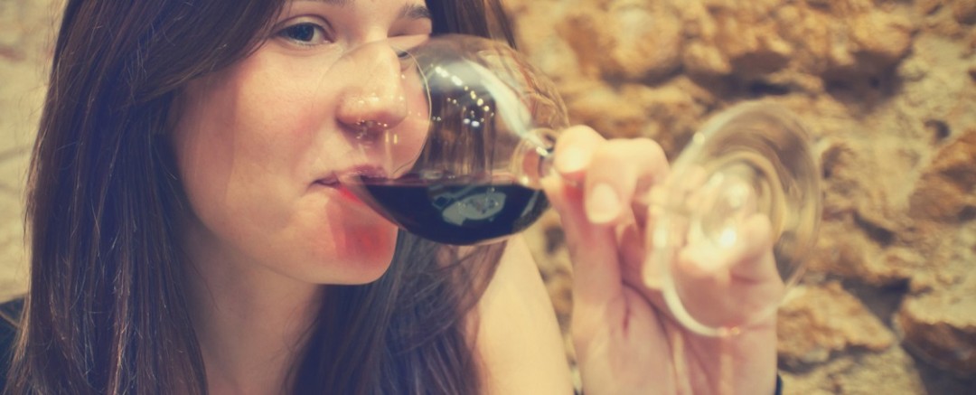 Pretty woman drinking wine